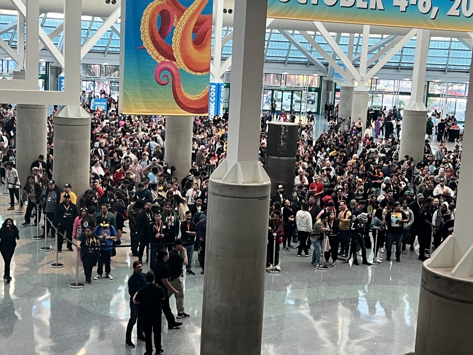 A packed crowd filling the convention center lobby